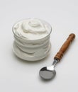 A bowl of yogurt on a white background