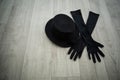 Bowler hat and black gloves in dance studio