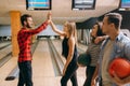 Bowler throws ball on lane and makes strike shot Royalty Free Stock Photo