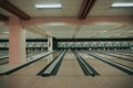 Bowling alley featuring lines to the right of the lane, decorated with graffiti Royalty Free Stock Photo