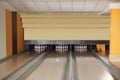 Bowling alley lanes with pins in club Royalty Free Stock Photo