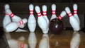 Bowling ball and falling pins Royalty Free Stock Photo