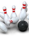 Bowling ball hitting all pins scoring strike, action shot, white background Royalty Free Stock Photo