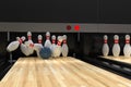 Bowling ball hitting all 10 pins, in a Strike