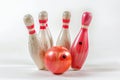 Bowling ball hitting pins scoring a strike Isolated on white background Royalty Free Stock Photo