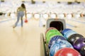 Bowling ball machine with woman bowling Royalty Free Stock Photo