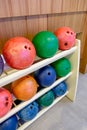 Bowling ball multi color row on wood rack Royalty Free Stock Photo