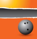 Bowling ball on orange ripped advertisement