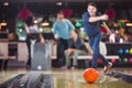 Bowling ball is rolling towards the pins Royalty Free Stock Photo