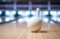 bowling ball rolls down a bowling alley to standing pins, bowling game concept