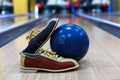 Bowling ball and shoes on lane background Royalty Free Stock Photo