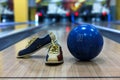 Bowling ball and shoes on lane background Royalty Free Stock Photo
