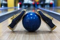 Bowling ball and shoes on lane background Royalty Free Stock Photo