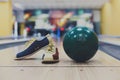 Bowling ball and shoes on lane background Royalty Free Stock Photo