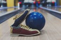 Bowling ball and shoes on lane background Royalty Free Stock Photo