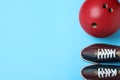 Bowling ball and shoes on blue background, flat lay. Space for text Royalty Free Stock Photo