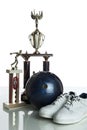 Bowling ball, shoes and tropies Royalty Free Stock Photo