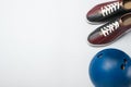 Bowling ball and shoes on white background, above view Royalty Free Stock Photo