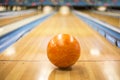 Bowling ball sitting in a colorful bowling alley lane Royalty Free Stock Photo