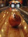 Bowling ball striking pins Royalty Free Stock Photo