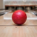 Red bowling ball on the track in the bowling center Royalty Free Stock Photo