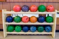 Bowling ball multi color row on wood rack Royalty Free Stock Photo