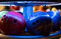 Brunswick bowling balls under UV light in bowling alley
