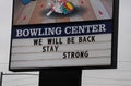 Bowling center sign saying `We will be back, stay strong