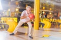 Nice aged man preparing to throw the ball