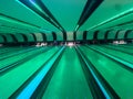 a bowling game place with green lighting and mirror