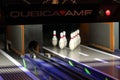 Bowling game track and white pins