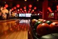 Bowling lane and balls in the row in bowling center. Royalty Free Stock Photo