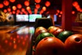 Bowling lane and balls in the row in bowling center. Royalty Free Stock Photo