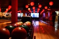 Bowling lane and balls in the row in bowling center. Royalty Free Stock Photo