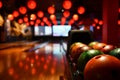 Bowling lane and balls in the row in bowling center. Royalty Free Stock Photo