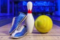 Bowling shoes and bowling ball on the game track close-up