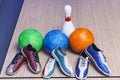 Bowling shoes and ball for playing the bowling game on track for a bowling game closeup Royalty Free Stock Photo