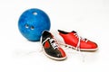 Bowling skittles and shoes on a white background. Bowling game Royalty Free Stock Photo