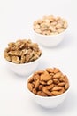 Bowls of almonds,wallnuts and pistachios Royalty Free Stock Photo