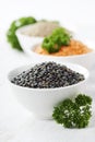 Bowls of assorted dried lentils with red lentils, black beluga l Royalty Free Stock Photo