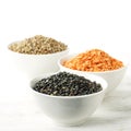 Bowls of assorted dried lentils with red lentils, black beluga l Royalty Free Stock Photo
