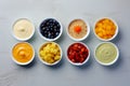 Bowls with baby food on grey background. Generative AI