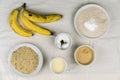 Bowls of baking ingredients and ripe bananas Royalty Free Stock Photo