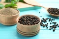 Bowls of black powdered pepper and corns Royalty Free Stock Photo