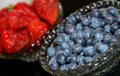 Bowls of blueberries and strawberries