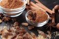 Bowls with cinnamon powder and sugar on table, closeup Royalty Free Stock Photo