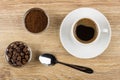 Bowls with coffee beans and ground coffee, cup with coffee Royalty Free Stock Photo