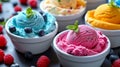 Bowls with colourful ice cream with mint, blueberry and raspberry