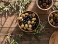 Bowls with different kind of olives green , black, kalamata on table Royalty Free Stock Photo