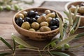 Bowls with different kind of olives green , black, kalamata on table